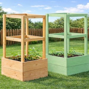 May include: Two wooden raised garden beds, one natural wood and one painted green, stand on a grassy lawn. Each has a square base and a trellis-like frame, perfect for growing vegetables or flowers.