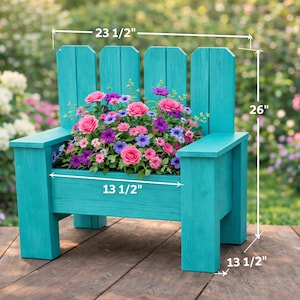 May include: A turquoise wooden planter shaped like a chair, filled with pink, purple, and blue flowers. The planter measures 59.7 cm wide, 66 cm tall, and 34.3 cm deep. The chair-shaped planter is a decorative garden accent.