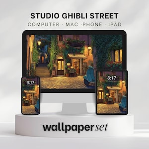 May include: A wallpaper set featuring a Studio Ghibli street scene displayed on a computer monitor, phone, and tablet. The scene depicts a European street with a scooter, buildings, and warm lighting. The time on the phone and tablet is 8:17.