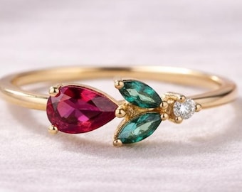 Anello a foglia in oro 14 carati con rubini e smeraldi, anello a fascia con diamanti e design floreale.