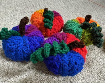 small multicolored pumpkins with stem and vine