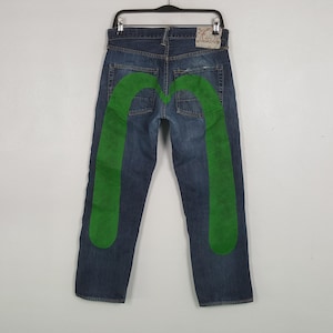 Vaqueros vintage de mezclilla con diseño personalizado de la marca japonesa EVISU Daicock, marca EVISU.