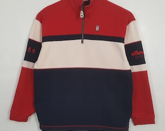 Sudadera vintage Ellesse con bloques de color azul y rojo.