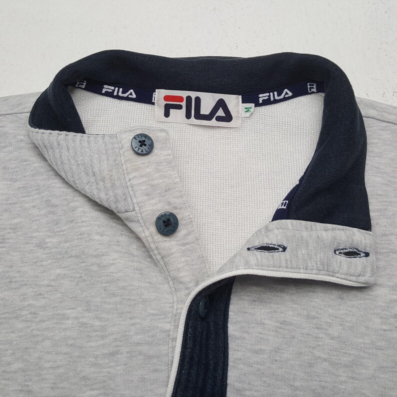 May include: A distressed wooden sign, reading "Welcome to our home" in white. The sign has a rustic finish, ideal for adding a welcoming touch to any home's entrance.