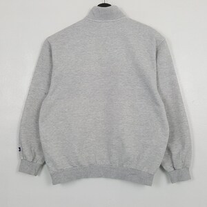 May include: A rustic wooden sign with the text "Welcome to our home" in white lettering. The sign has a distressed finish and a simple, inviting design, ideal for a front porch or hallway.