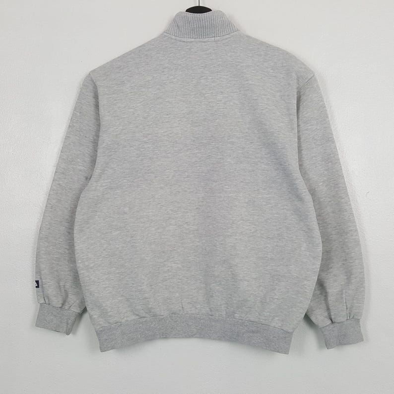 May include: A rustic wooden sign with the text "Welcome to our home" in white lettering. The sign has a distressed finish and a simple, inviting design, ideal for a front porch or hallway.