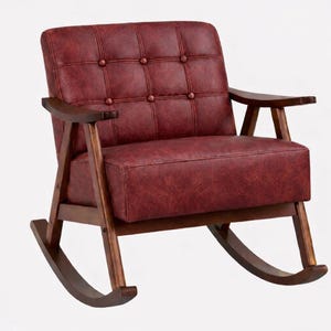 May include: A red leather rocking chair with a button-tufted back and seat. The chair has dark wooden armrests and a wooden frame. The rocking chair is designed for comfort and relaxation.