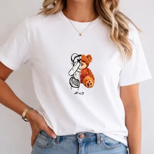 May include: A set of three ceramic mugs with a speckled, matte finish. The mugs are in shades of cream, light gray, and dark gray. Each mug has a simple, minimalist design, perfect for coffee or tea.