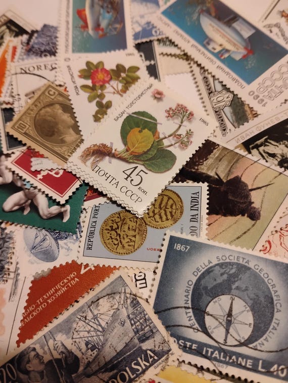 worldwide postage stamps mint and canceled 1900 to present. Lot of 150 stamps