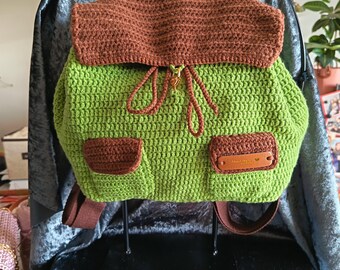 green and brown crocheted backpack