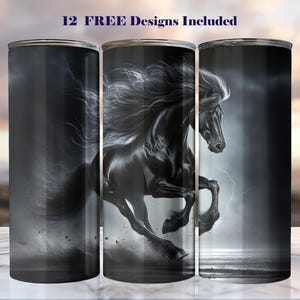May include: A black tumbler featuring a majestic black horse in full gallop against a stormy background. The design includes the text "12 FREE Designs Included". The tumbler is cylindrical and appears to be made of stainless steel.