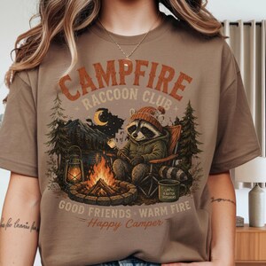 Campfire Raccoon Club Shirt, Funny Camping Raccoon Tee, Happy Camper Graphic T-Shirt, Cozy Campfire Outdoor Shirt, Nature Lover Gift