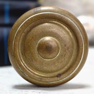Antique solid brass door knob set for old house restoration, historic interiors, and architectural salvage decor.