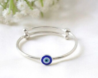 Protect your little one with the TruShield Bangle — a 925 sterling silver evil eye bangle designed for babies, toddlers and kids