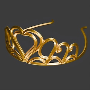May include: A gold-colored tiara with a heart-shaped design. The tiara features multiple heart shapes connected in an arched pattern, with a thin band for securing it to the head. The overall design is elegant and suitable for special occasions.