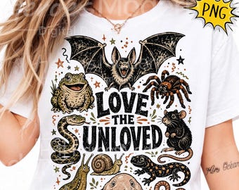 May include: A white t-shirt featuring a graphic print of a bat, frog, spider, snake, rat, snail, lizard, worm, and blobfish. The text "LOVE THE UNLOVED" is printed in the centre in a bold, black, distressed font surrounded by small stars.