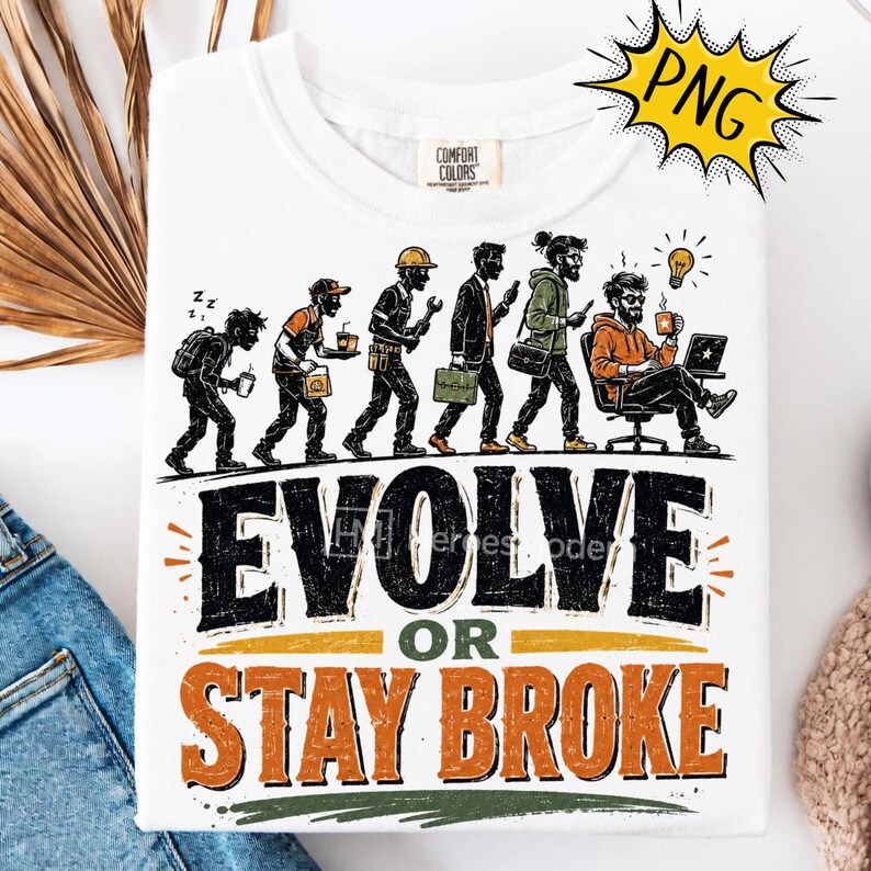 May include: A white t-shirt featuring a graphic illustration of human evolution from a student to a professional working at a desk. Below the figures, the text reads EVOLVE OR STAY BROKE in large black and orange letters. The shirt has a crew neck.