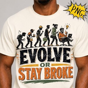 May include: A cream-colored t-shirt featuring a graphic illustration of human evolution from a tired person to a professional working at a desk. Below the figures, the text reads EVOLVE OR STAY BROKE in large black and orange block lettering.