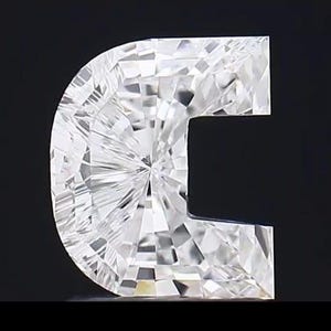 May include: A clear, faceted gemstone in a unique C-shape, set against a black background. The gem's surface reflects light, showcasing its intricate cuts and brilliance. The overall design is modern and eye-catching.