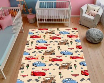 May include: A rectangular beige rug featuring a repeating pattern of cartoon cars in red, blue, and brown. The design includes checkered flags, stars, and traffic lights. The rug is suitable for a child's room.