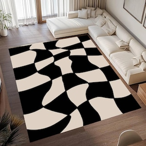 May include: A large area rug with a black and cream checkerboard pattern. The design features distorted, wavy lines that create a unique visual effect. The rug is placed on a hardwood floor, with a white sofa in the background.