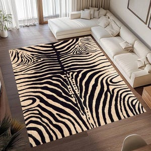 May include: A rectangular rug featuring a zebra stripe design in black and beige. The rug is laid on a wooden floor. A white sofa is in the background. The rug's dimensions are approximately 200cm x 300cm.