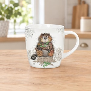 May include: A white ceramic mug featuring a detailed illustration of a beaver sitting on a tree stump. The beaver has a patchwork-style body with brown, orange, and black patterns, holding a small log and green leaves, surrounded by line art foliage.
