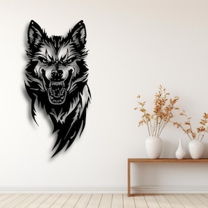May include: A black metal wolf head wall art piece. The wolf is depicted with an open mouth, baring its teeth. The artwork is mounted on a white wall. The wolf's fur is detailed with intricate lines.