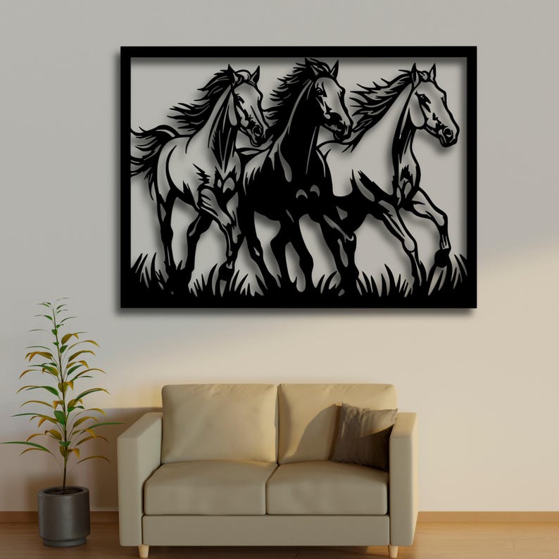 May include: A black metal wall art piece featuring three running horses. The horses are depicted in silhouette, with flowing manes and tails, set against a neutral background. The artwork is framed in a black border and includes a grassy base.