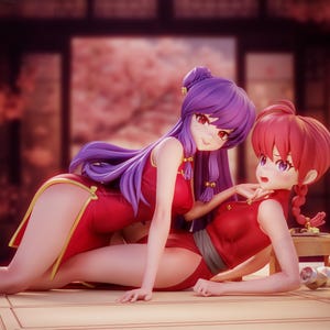 May include: Two anime-style figures in red dresses with gold accents. One figure has long purple hair and is leaning over the other, who has red hair. The figures are posed on a light-colored surface, with a blurred background of a traditional Japanese-style room.