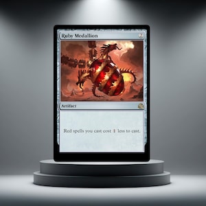 May include: A Magic: The Gathering card titled "Ruby Medallion" on a display stand. The card features a red and gold artifact with a dragon-like design against a fiery background. The text reads "Red spells you cast cost 1 less to cast."
