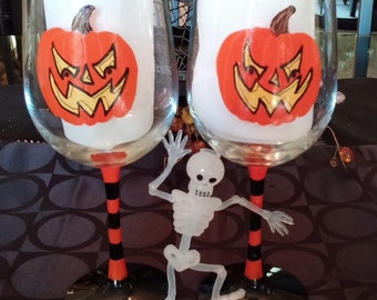 Jack o lantern Halloween hand painted wine glasses.