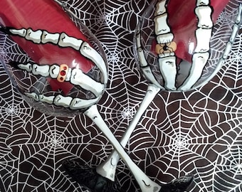 Skeleton hand Halloween hand painted wine glasses.