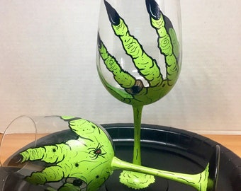 Green witch hand Halloween hand painted wine glasses.