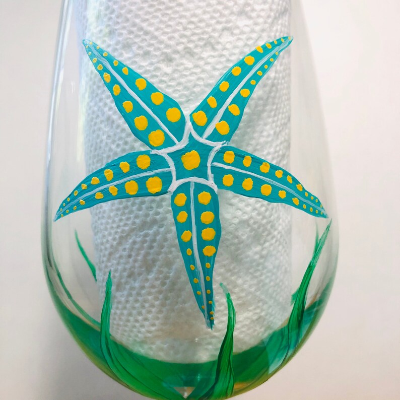 Fish and starfish hand painted wine glasses.