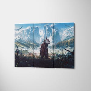 May include: A three-panel canvas wall art set depicting a fantasy scene with a lone figure standing in a field, facing snow-capped mountains under a bright blue sky. The figure wears dark armor and carries a large sword strapped to their back.