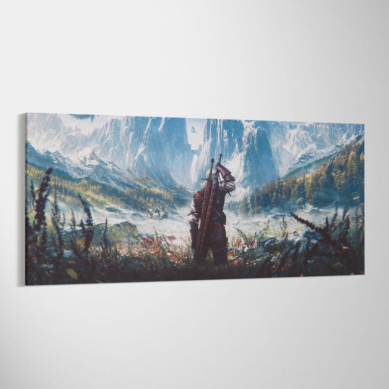 May include: A rectangular canvas print featuring a fantasy landscape with a central figure seen from behind, wearing leather armor and carrying two swords on their back. The scene depicts snow-capped mountains, a valley, and dark foliage.