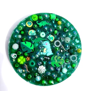 Dino Dinosaur green reusable picky pad, remeltable sensory fidget toy, skin picking relief.