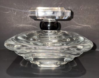 vintage Lancôme Trésor factice, a large glass dummy bottle designed for store displays.It measures approximately 6 inches tall and 10 inches