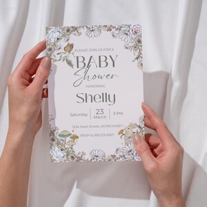 May include: A baby shower invitation with floral and butterfly illustrations. The invitation reads "PLEASE JOIN US FOR A BABY Shower HONORING Shelly" with the date, time, and RSVP information. The design features a soft color palette.