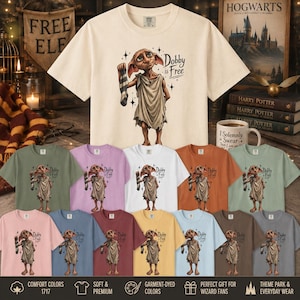 May include: A collection of short-sleeve t-shirts in various colors, each featuring a graphic of the character Dobby holding a sock with the text Dobby is Free. The shirts are displayed in a grid layout, showcasing a range of solid fabric colors.