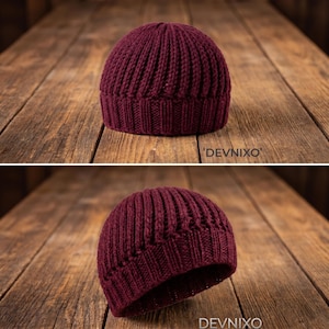 May include: A burgundy knit beanie hat with a ribbed design. The hat is made of a thick, warm material and is displayed on a wooden surface. The text "DEVNIXO" is visible.