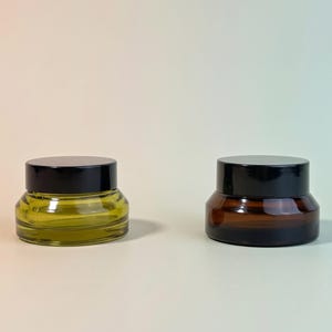 15g 30g 50g Clear Glass Cream Jar with a Black Glossy Plastic Lid, Amber Green Empty Sample Jar for Makeup Wholesale