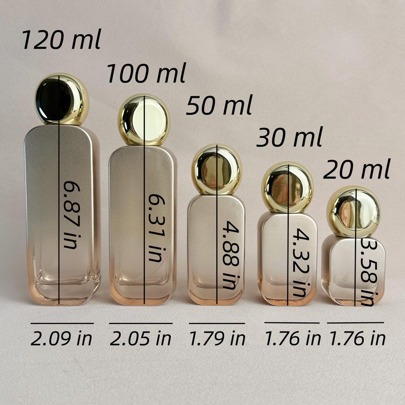 May include: Five perfume bottles of varying sizes, labeled 20 ml to 120 ml, with gold-colored spherical caps. The bottles are rectangular with rounded corners and are measured in inches. The largest bottle is 6.87 inches tall.