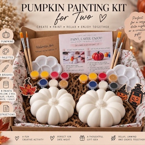 May include: A pumpkin painting kit in a cardboard box containing two white ceramic pumpkins, two white cloud-shaped paint palettes, four wooden paintbrushes, and sixteen small paint pots in various colours, with an instruction card included.