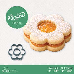 May include: A flower-shaped Linzer cookie with powdered sugar, filled with orange jam, next to a flower-shaped cookie cutter. The image includes the text "Linzer 2 PIECE SET" and "AVAILABLE IN 4 SIZES 2" 2.5" 3" 3.5"".