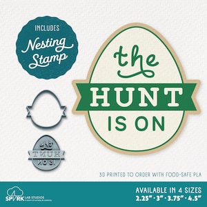 May include: An assortment of Easter-themed items, including a nesting stamp, egg-shaped cookie cutters, and a sign that reads "the HUNT IS ON." The sign is egg-shaped with green text and a tan border. Available in 4 sizes: 2.25", 3", 3.75", and 4.5".