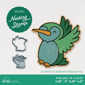May include: A colorful penguin cookie cutter and nesting stamp set. The penguin is blue and green with an orange beak. The set includes a nesting stamp and two cookie cutter outlines. Available in 4 sizes: 2.25", 3", 3.75", and 4.5".