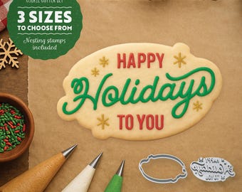 May include: A cookie cutter set with a cookie that says "Happy Holidays To You". The set includes nesting stamps and three sizes to choose from. Also included are icing bags and a bowl of sprinkles.