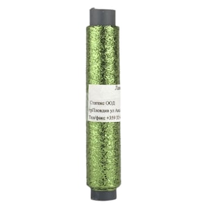 May include: A green glitter thread spool with grey ends. A white label with text is attached. The thread has a sparkly, textured finish. The spool is approximately 10 cm in length.